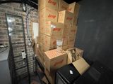 a stack of boxes sitting on top of a table next to a microwave
