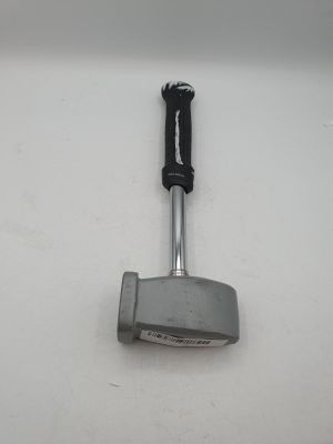a close up of a golf putter on a white surface