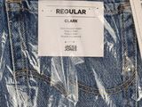 a close up of a pair of jeans with a tag on it