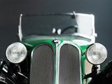 a close up of a green car with a black background