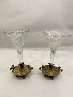 pair of antique glass vases with brass handles on a white background