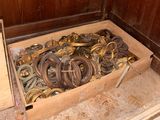 a wooden box filled with lots of different types of hoses