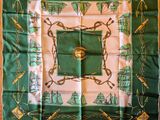 a green and white scarf with a picture of a horse