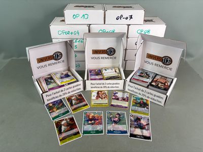 several boxes of cards are stacked on top of each other on a table