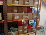 many boxes on the shelves in the room