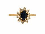 bague en or ornée d'un saphir bleu et de diamants blancs