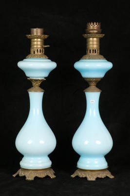 pair of blue glass candlesticks with gold trim