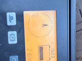 a close up of a microwave with a yellow screen