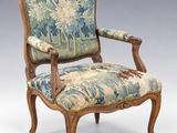 an image of a chair with a floral upholstered back and arms