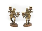 pair of antique brass figurines of a man and a woman