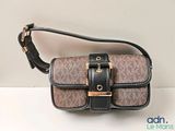 michael korsh cross body bag in brown and black with gold hardware