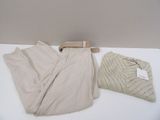a pair of pants and a sweater sitting on a table