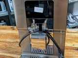 an image of a coffee machine on a wooden table