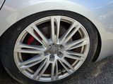 a close up of a car tire on the road