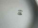 an image of a close up of a white plate with a flower on it