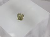 a close up of a yellow diamond sitting on top of a white box