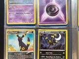 a lot of different pokemon cards on the table