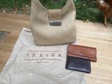 a bag, wallet, and chicken on a table