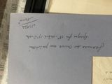 a piece of paper with writing on it next to a piece of paper with writing on it