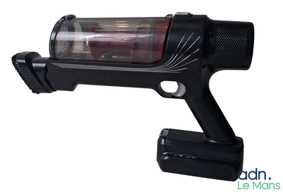 an image of a black gun with a red light