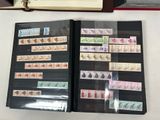 a lot of stamps on the pages of a book