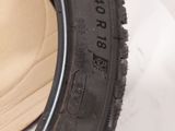 a close up of a tire on a white surface