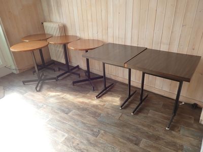 three tables that are sitting in a room