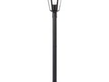a black lamp post with a light on top of it