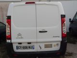 a white van that is parked in a parking lot