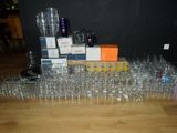 a lot of empty wine glasses on the floor
