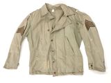 an old military jacket with patches on the sleeves and shoulder