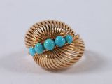 an image of a gold ring with turquoise stones on it