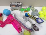 many tennis balls, tennis rackets, tennis balls, tennis balls, tennis balls, tennis balls, and a tennis bag on a table