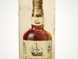 an old box with a bottle of wine on it