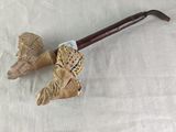 a pipe with a wooden handle on a white cloth