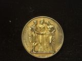 an image of a gold medal on a black surface
