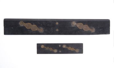 three pieces of black wood with brass hardware on a white background