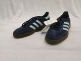 blue adidas sneakers with brown soles on a white background