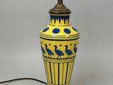 an image of a yellow and blue vase lamp with birds on it