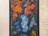 a painting of flowers in a vase on a easel