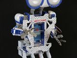 a robot that is standing on a black surface