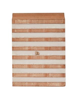 a close up of a white and brown striped box on a white background