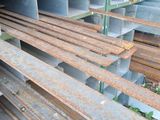 a pile of steel bars stacked on top of each other