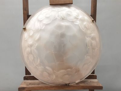 a large white object sitting on a wooden stand