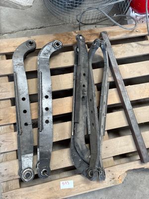 some old tools on a pallet next to a fan