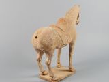 statue of a horse with a saddle on its back