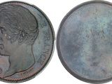 a close up of a coin with a woman ' s face on it