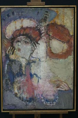 a painting of a woman with a hat on a easel