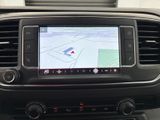 the dashboard of a car with a gps device in the center