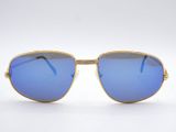 a pair of sunglasses with blue lenses on a white background